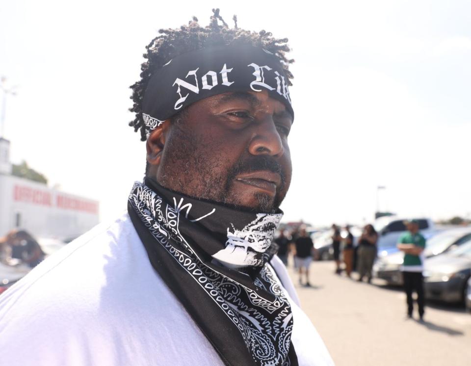 A vendor sells "Not Like Us" bandanas before the Kendrick Lamar Pop Out concert