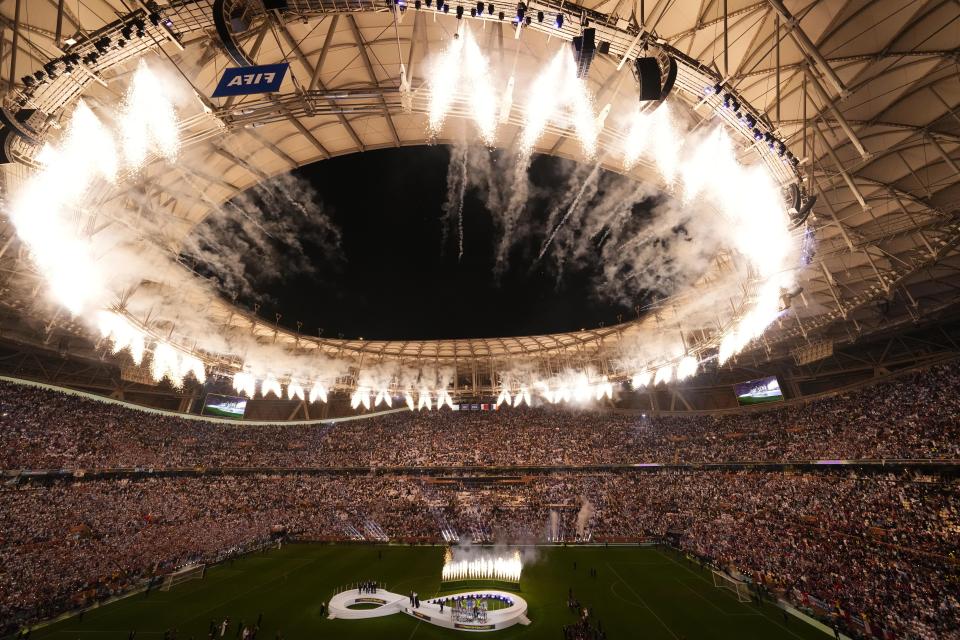 FILE - Fireworks explode as Argentina's team receives the trophy at the end of the World Cup final soccer match between Argentina and France at the Lusail Stadium in Lusail, Qatar, on Dec. 18, 2022. Just over a year on from Messi winning the World Cup, what sporting legacy has it left in Qatar? (AP Photo/Hassan Ammar, File)