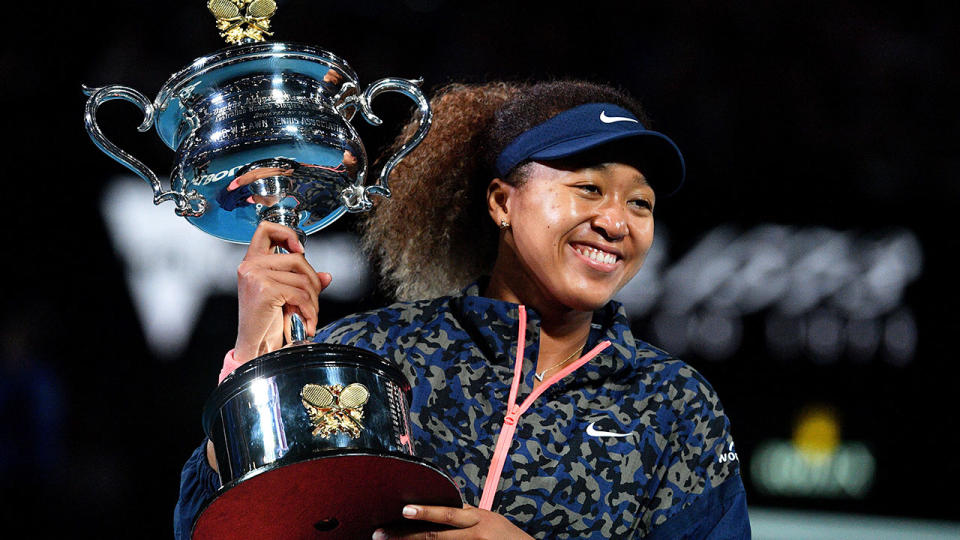 Pictured here, Naomi Osaka celebrates with the 2021 Australian Open trophy in hand.