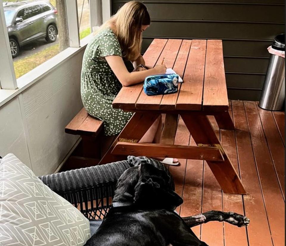 The family’s Great Dane keeps Marie company on the screened-in porch where she likes to do her therapy homework. 