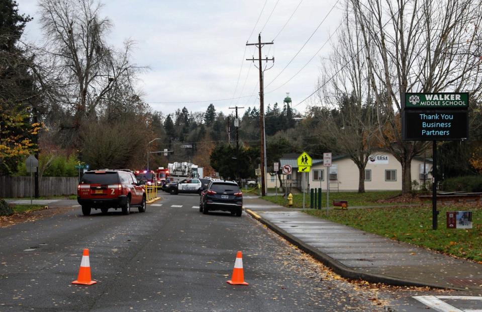 Salem Fire Department and Salem Police Department crews respond to a fire at a home where two people were found dead Friday morning in West Salem.