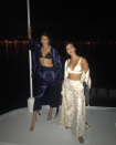 <p>“Night life,” Kourtney wrote beside a pic of herself and Kendall chilling by the water’s edge. Though they weren’t technically in bathing suits, they both wore a shiny bra top with their wide-legged pajama pants. (Photo: Kourtney Kardashian via Instagram) </p>