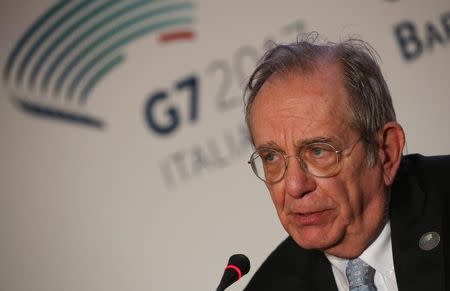 FILE PHOTO: Italy's Finance Minister Pier Carlo Padoan attends a news conference during a G7 for Financial ministers, in the southern Italian city of Bari, Italy May 13, 2017. REUTERS/Alessandro Bianchi/ File Photo