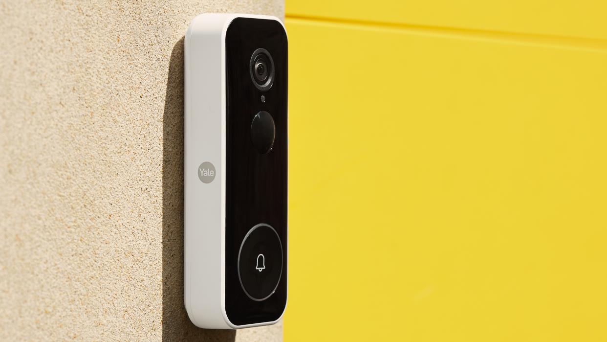  Yale Smart Video Doorbell review: device on a white wall from the side . 