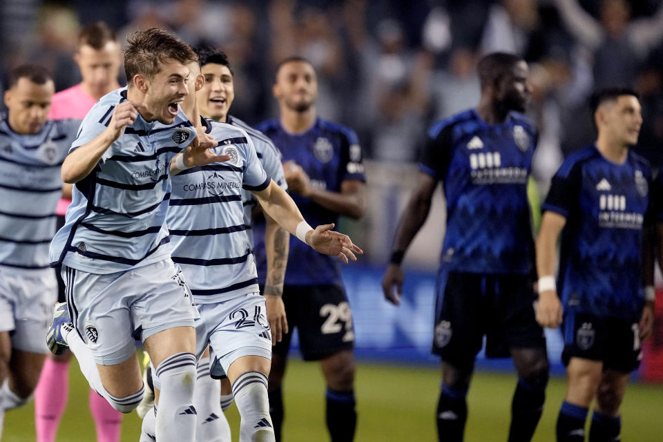 Sporting Kansas City players celebrate after winning a penalty shootout against San Jose Earthquakes during an MLS soccer wild-card playoff match Wednesday, Oct. 25, 2023, in Kansas City, Kan. (AP Photo/Charlie Riedel)