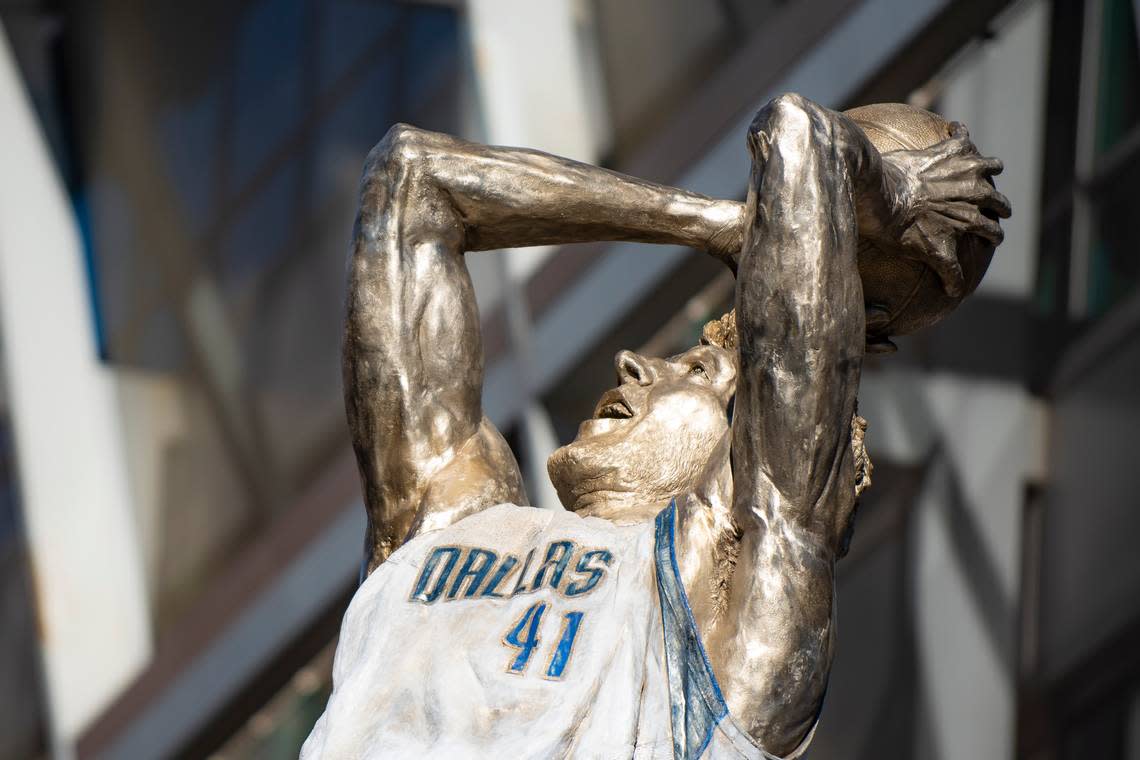 Dirk Nowitzki’s statue is unveiled during the “All Four One” statue ceremony in front of the American Airlines Center in Dallas, Sunday, Dec. 25, 2022. (AP Photo/Emil T. Lippe)