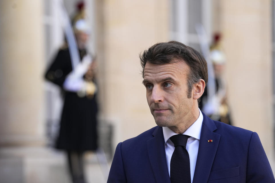 French President Emmanuel Macron listens to Netherlands Prime Minister Mark Rutte as they meet reporters before their meeting at the Elysee Palace in Paris, Wednesday, March 9, 2022. Netherlands Prime Minister Mark Rutte is for bileteral talks in Paris. (AP Photo/Michel Euler)