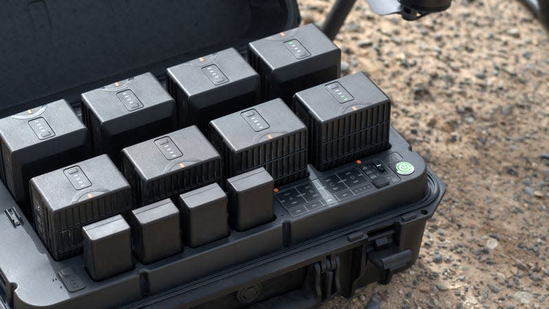 The DJI BS65 Intelligent Battery Station charging several drone batteries at the same time.