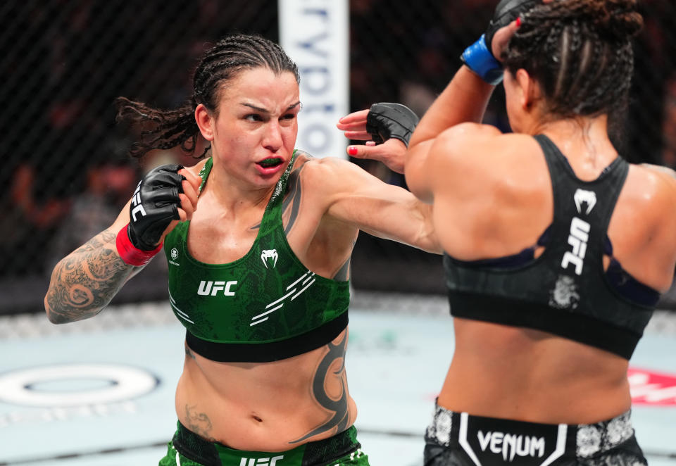 TORONTO, ONTARIO - JANUARY 20: (L-R) Raquel Pennington punches Mayra Bueno Silva of Brazil in a UFC bantamweight championship bout during the UFC 297 event at Scotiabank Arena on January 20, 2024 in Toronto, Ontario. (Photo by Jeff Bottari/Zuffa LLC via Getty Images)