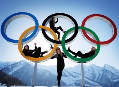 Shelly Gotlieb, Stefi Luxton, Christy Prior and Rebecca Torr of New Zealand pose for a picture at the with the Olympic Rings at Athletes Village