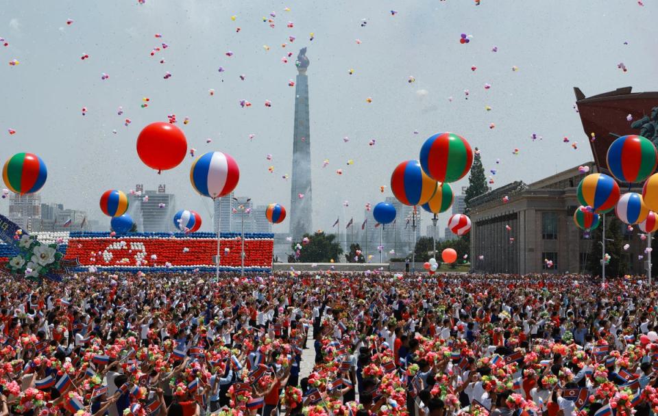 People release balloons in the air as Russia's president Vladimir Putin and North Korea's leader Kim Jong-un attend a welcoming ceremony at Kim Il Sung Square in Pyongyang on June 19, 2024 (POOL/AFP via Getty Images)