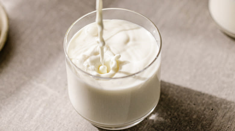 glass of milk being poured