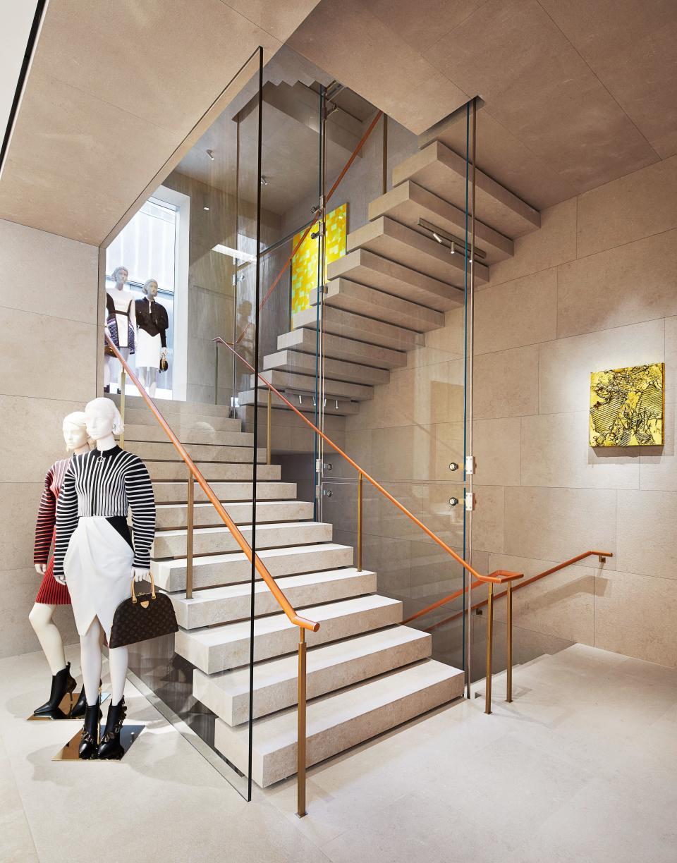 An artwork by Anselm Reyle (right) is displayed on the concrete staircase.
