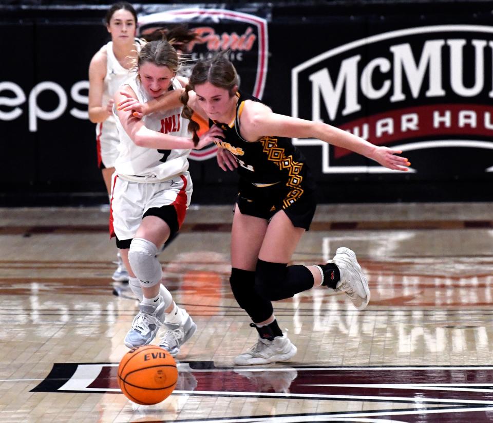 Jim Ned guard Emma Doran and Seminole's Channing Howard battle for a loose ball during the championship game of the Pug Parris Classic on Nov. 19 at McMurry's Kimbrell Arena.