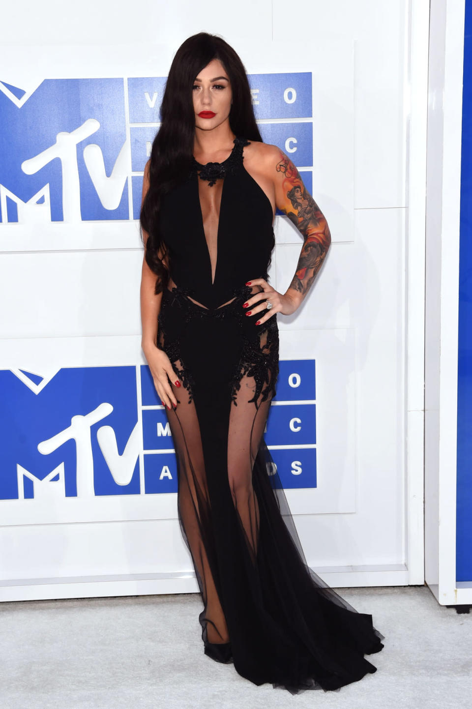 Reality star Jenni Farley, also known as Jwoww, wearing a black halter dress. 