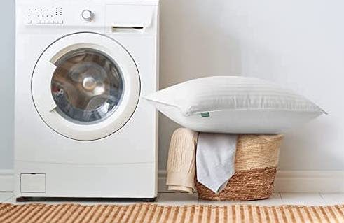 pillow next to a washing machine