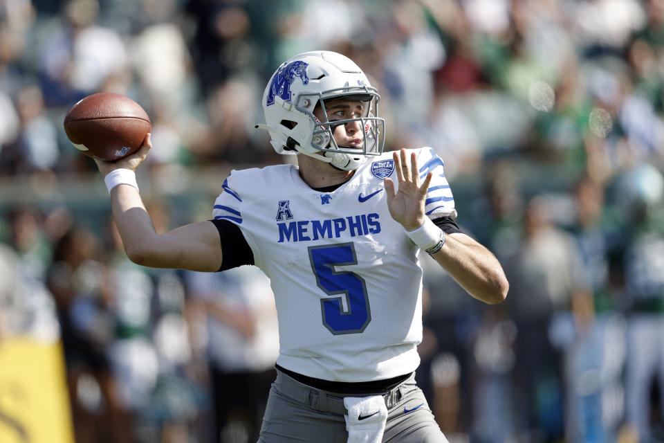 Memphis quarterback Seth Henigan (5) throws the ball during an NCAA college football game against Tulane in New Orleans, Saturday, Oct. 22, 2022. Tulane won 38-28. (AP Photo/Tyler Kaufman)