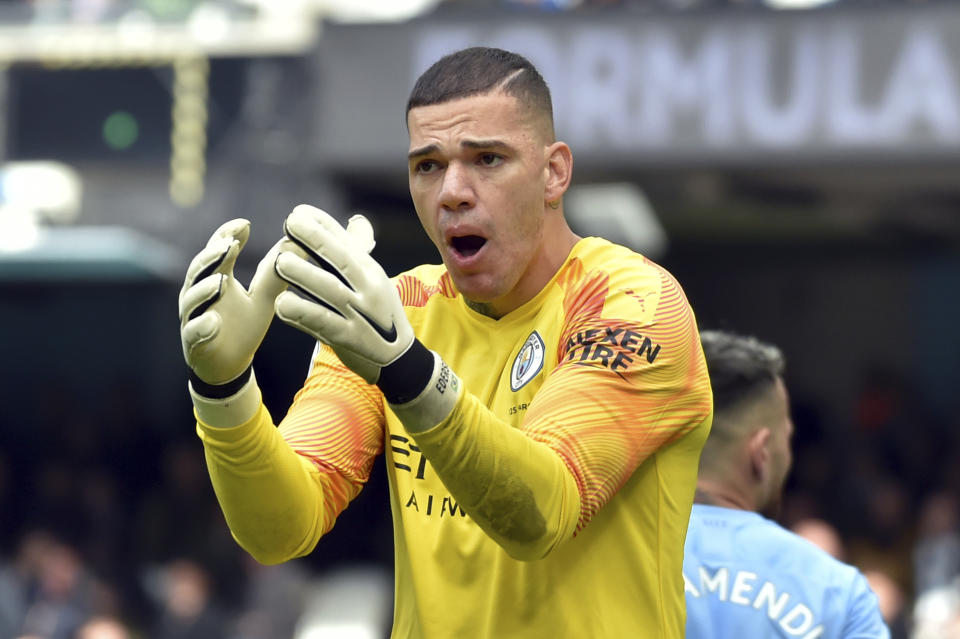 Manchester City's goalkeeper Ederson reacts after receiving a yellow card during the English Premier League soccer match between Manchester City and Wolverhampton Wanderers at Etihad stadium in Manchester, England, Sunday, Oct. 6, 2019. (AP Photo/Rui Vieira)