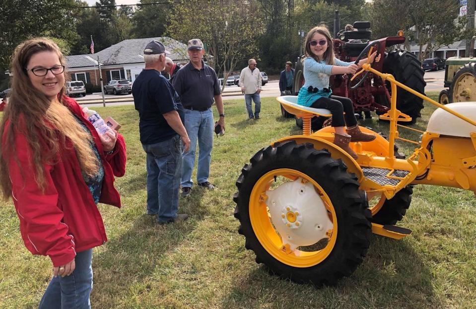 Families enjoy the vintage tractors at the 7th Annual Czech and Slovak Folklife Festival in Prince George in October 2019.