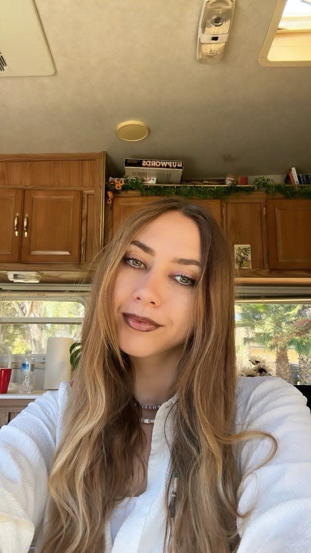 Kayla McDaniel poses in her recreational vehicle at the Ventura Beach RV Resort.