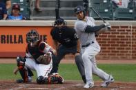 Jul 11, 2018; Baltimore, MD, USA; New York Yankees right fielder Giancarlo Stanton (27) hits a rbi single scoring designated hitter Aaron Judge (not pictured) during the third inning against the Baltimore Orioles at Oriole Park at Camden Yards. Mandatory Credit: Tommy Gilligan-USA TODAY Sports