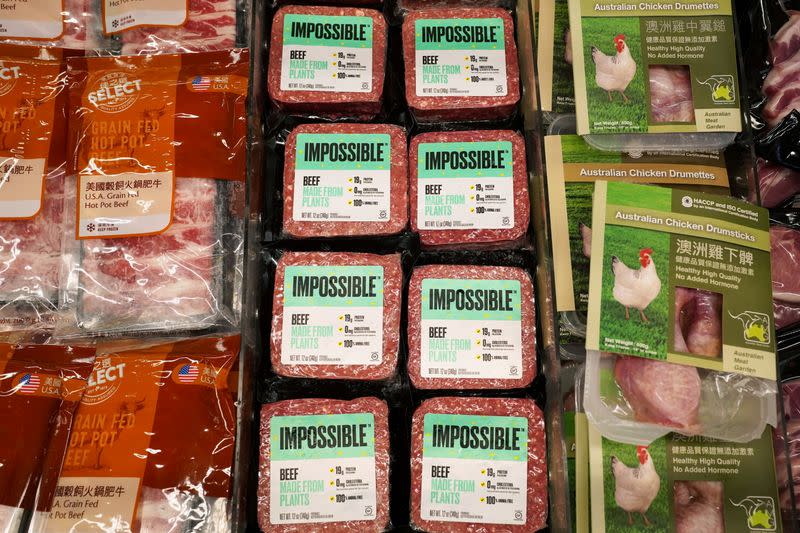 FILE PHOTO: Impossible Foods plant-based beef products are seen in between other meat products inside a refrigerator at a supermarket in Hong Kong