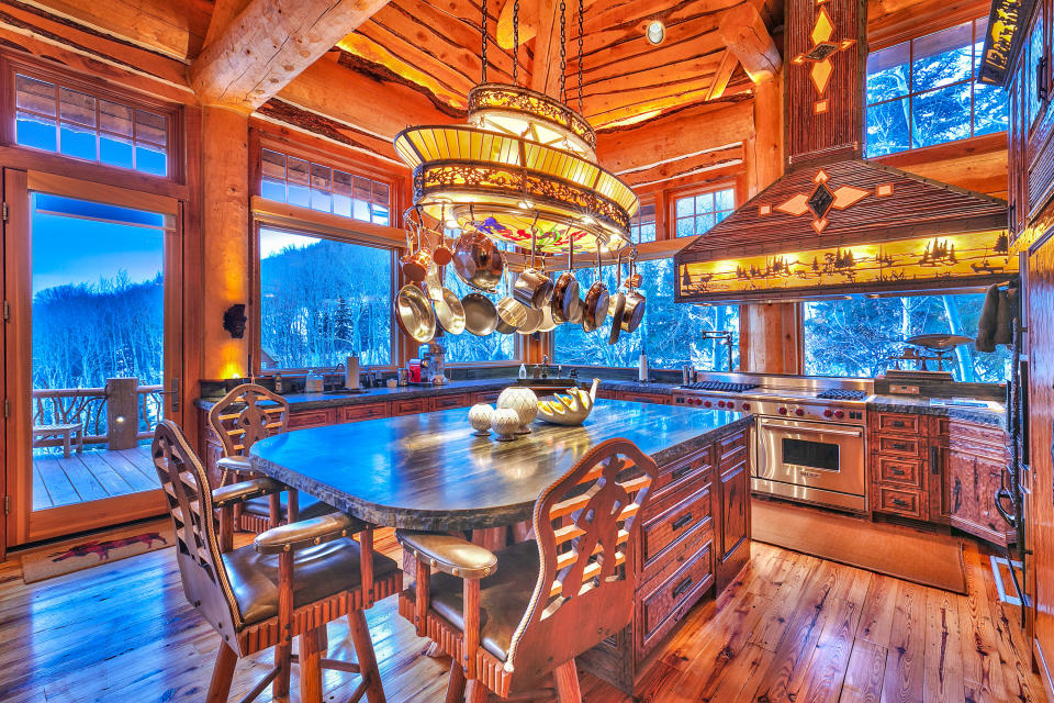 The kitchen was relocated to have a stunning view of the surrounding valley. (<a href="https://www.toptenrealestatedeals.com/weekly-ten-best-home-deals/home/mitt-romneys-utah-mountain-ski-home" rel="nofollow noopener" target="_blank" data-ylk="slk:Top Ten Real Estate Deals;elm:context_link;itc:0;sec:content-canvas" class="link ">Top Ten Real Estate Deals</a>)