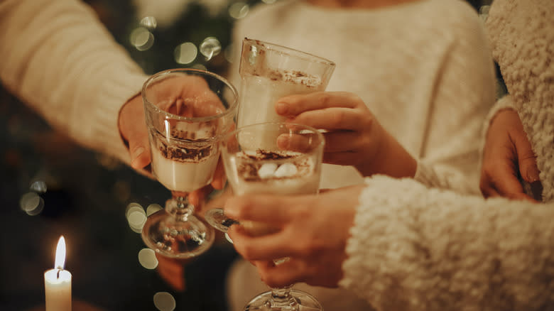 People toasting with eggnog