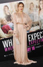 <b>Don't trip J.Lo!</b><br><br>Dripping in jewels and a plunging Lucia Hohan gown, Jennifer Lopez evokes old Hollywood glamour at the Los Angeles premiere of her film "<a href="http://movies.yahoo.com/movie/what-to-expect-when-youre-expecting/" data-ylk="slk:What to Expect When You're Expecting;elm:context_link;itc:0;sec:content-canvas" class="link ">What to Expect When You're Expecting</a>" on Monday night. <br><br>Is there such a thing as <em>below</em> floor length? Aside from the dramatic neckline, J.Lo's full-length, nude-toned, fabric-full Grecian dress completely drapes her, falling well below her feet.<br><br>The 42-year-old fared well as she brought her 25-year-old boyfriend, dancer Casper Smart, who would have probably picked her up if she fell.<br><br>"What to Expect" opens in theaters this Friday.