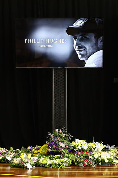 Flowers given to the Hughes family have been laid inside the Macksville High School Stadium ahead of the funeral service.