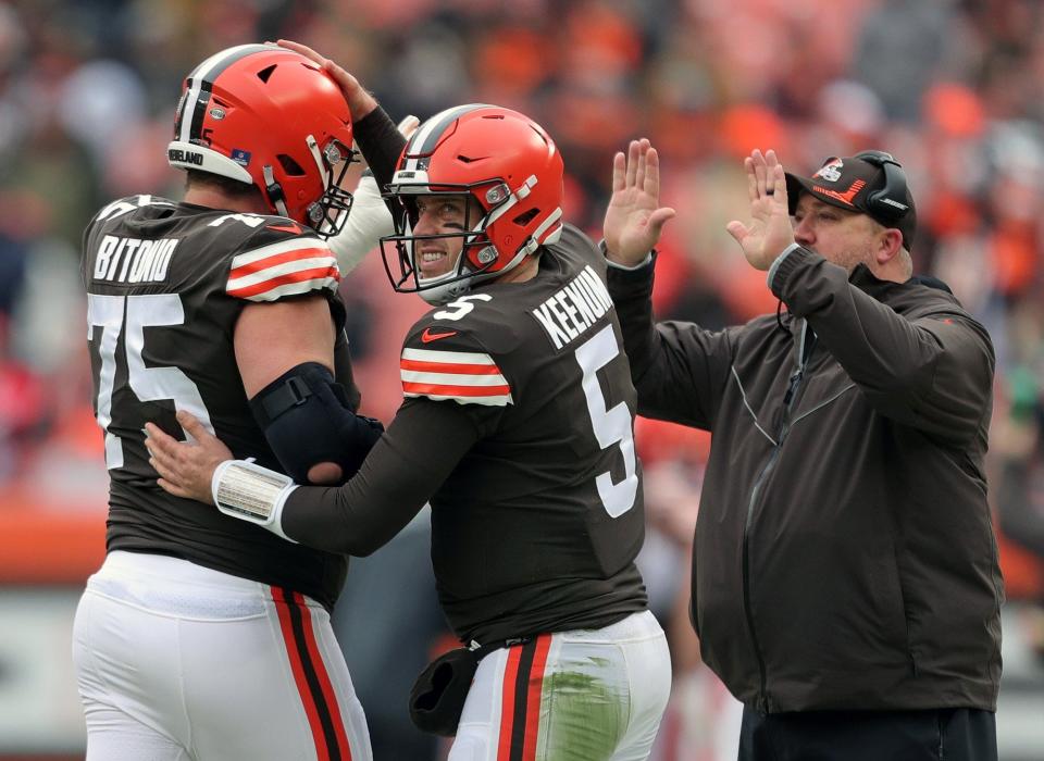 Browns quarterback Case Keenum (5) celebrates with guard Joel Bitonio (75) after a scoring drive during the first half against the Cincinnati Bengals, Sunday, Jan. 9, 2022, in Cleveland.