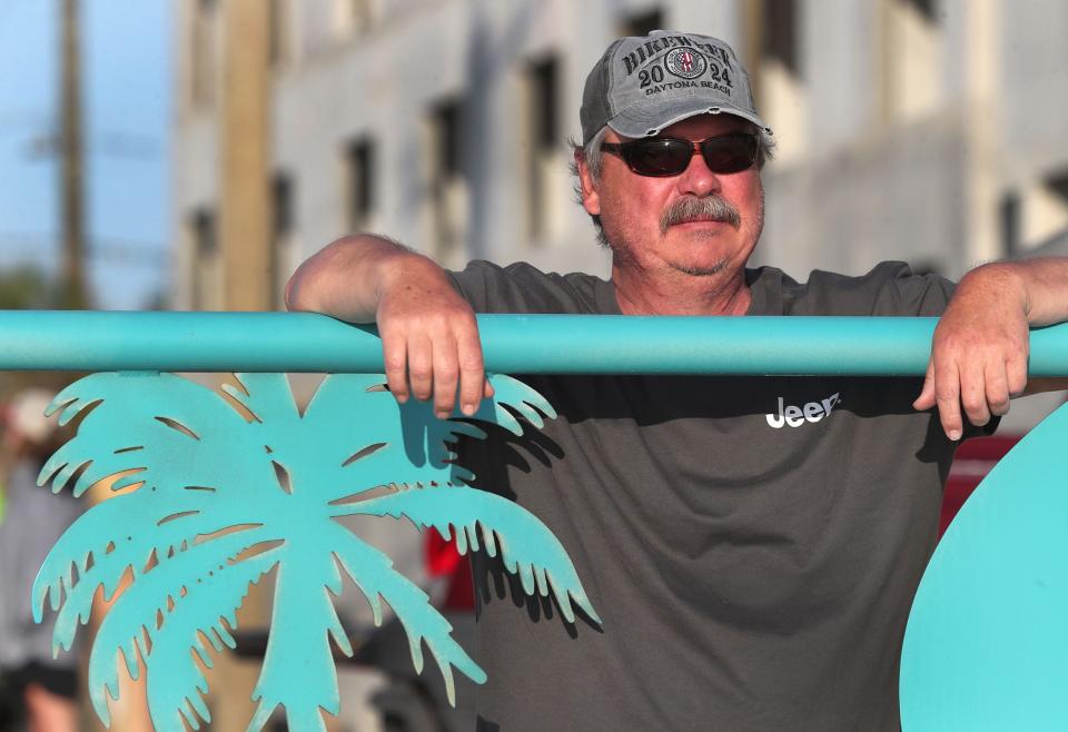 Jeep enthusiast John Geisinger, of Anderson, Ind., checks out the ocean at the University Boulevard beach ramp on Wednesday, as he waitsout  high tide that delayed access to the Jeeps At the Rock event at Hard Rock Hotel. The Hard Rock party, which continues on Thursday, is part of the 10-day Jeep Beach event in Daytona Beach.