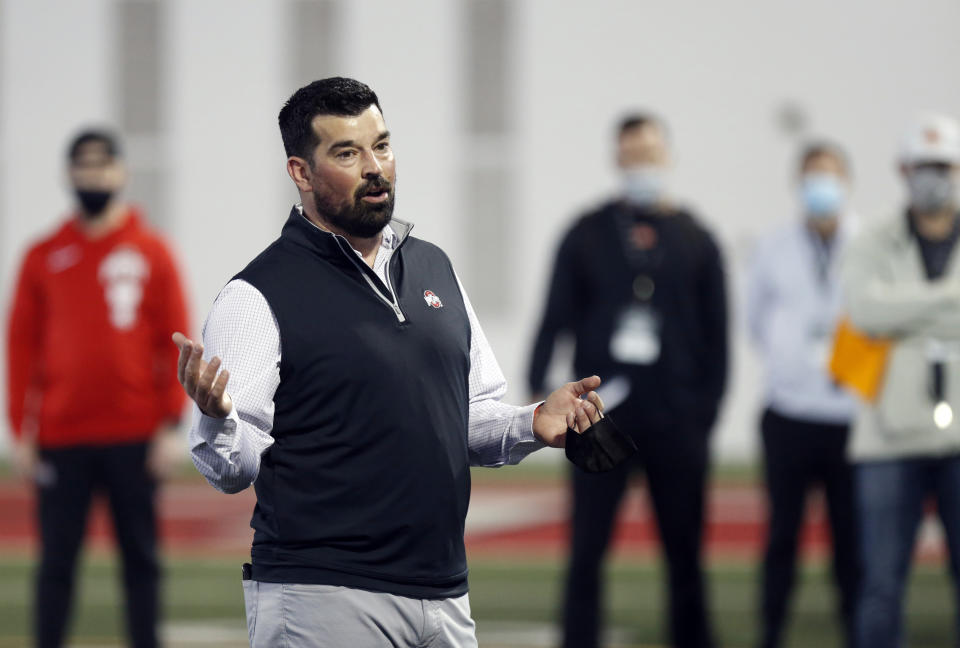 FILE - Ohio State football coach Ryan Day welcomes coach and scouts to an NFL Pro Day at Ohio State University in Columbus, Ohio, in this Tuesday, March 30, 2021, file photo. With two-time Big Ten player of the year Justin Fields departing for the NFL, returning backups C.J. Stroud and Jack Miller III and five-star January enrollee Kyle McCord took the snaps in spring practice. Stroud was believed to be the front-runner entering the spring, but coach Ryan Day said a starter might not be determined until the week of the Sept. 2 opener at Minnesota. (AP Photo/Paul Vernon, File)