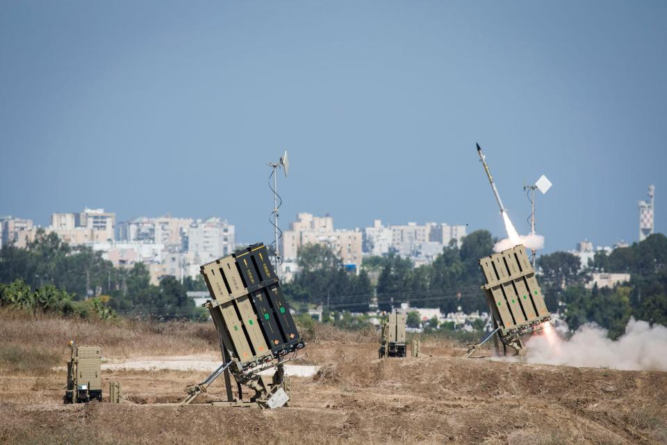 Animage a close up picture of one of the Iron Dome array shooting a missile on a clear day in 2014