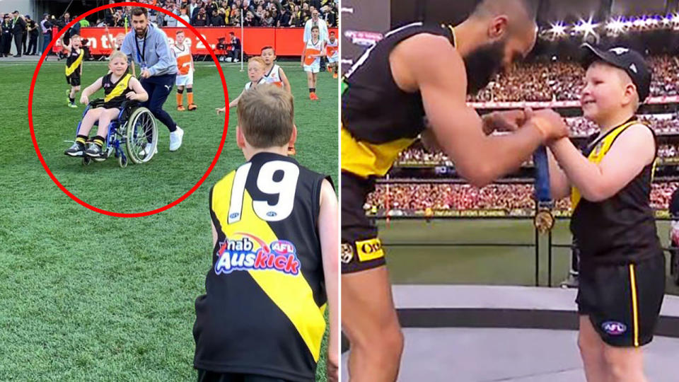 Henry Baum, pictured here presenting Bachar Houli with his medal after the AFL grand final.