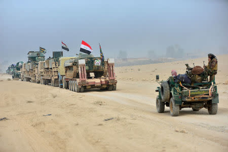 Popular Mobilization Forces (PMF) take part in an operation against Islamic State militants on the outskirts of the town of Hammam Al-Alil, south of Mosul, Iraq October 31, 2016. REUTERS/Stringer