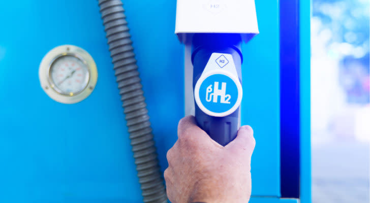 Hydrogen Stocks Man hold a fuel dispenser with hydrogen on gas station. h2 combustion engine for emission free eco friendly transport. Plug Power is one such company working on this power source.