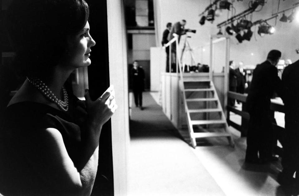 Not originally published in LIFE. Jackie Kennedy watches from the wings as her husband debates Richard Nixon, 1960. (Paul Schutzer—Time & Life Pictures/Getty Images) <br> <br> <a href="http://life.time.com/history/kennedy-and-nixon-in-1960-debates-that-changed-the-game/#1" rel="nofollow noopener" target="_blank" data-ylk="slk:Click here to see the full collection at LIFE.com;elm:context_link;itc:0;sec:content-canvas" class="link ">Click here to see the full collection at LIFE.com</a>