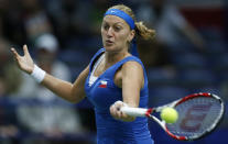 Czech Republic's Petra Kvitova returns a ball to Italy's Roberta Vinci during their Fed Cup semifinal tennis match in Ostrava, Czech Republic, Sunday, April 20, 2014. (AP Photo/Petr David Josek)