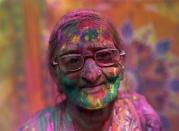 <span><b>14th most popular.</b><br>A widow daubed in colours takes part in Holi celebrations organised by non-governmental organisation Sulabh International at a widows' ashram at Vrindavan, in the northern Indian state of Uttar Pradesh, March 3, 2015. (REUTERS/Ahmad Masood)</span>