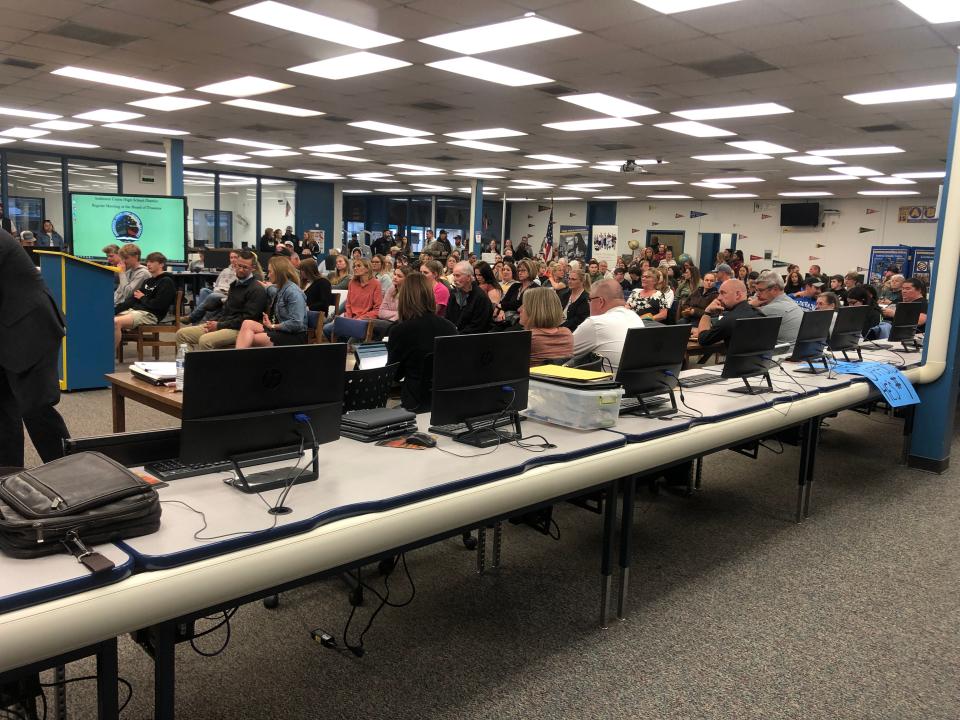 Residents listen to speeches from Anderson Union High School District Board of Trustees members on Tuesday, April 18, 2023.