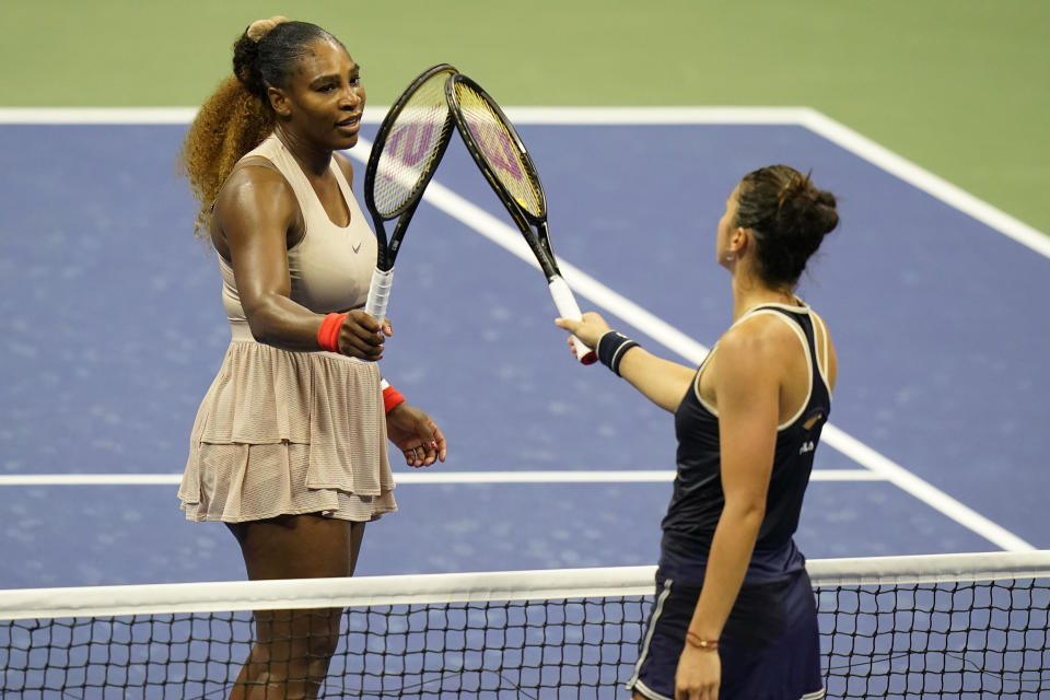 Serena Williams, of the United States, left, taps rackets with Margarita Gasparyan, of Russia, during the third round of the U.S. Open tennis championships, Thursday, Sept. 3, 2020, in New York. Williams won the match. (AP Photo/Frank Franklin II)