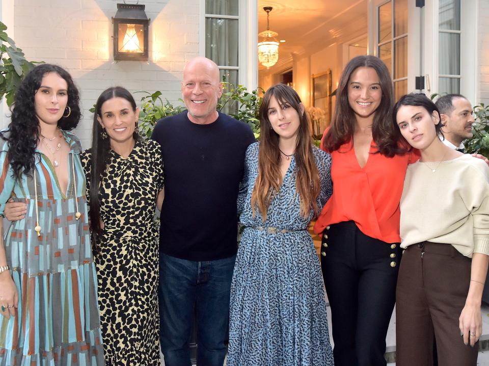 Rumer Willis, Demi Moore, Bruce Willis, Scout Willis, Emma Heming Willis, and Tallulah Willis pose for photos at a 2019 event.