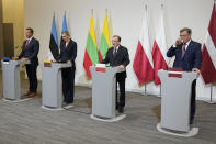 From left, Estonia's Interior Minister Lauri Laanemets, Lithuania's Interior Minister Agne Bilotaite, Poland's Interior Minister Mariusz Kaminski, and Latvia's Interior Minister Maris Kucinskis speak to reporters following talks in Warsaw, Poland, Monday, Aug. 28, 2023. NATO members Poland and the Baltic states will seal off their borders with Russia’s ally Belarus in the event of any military incidents or a massive migrant push by Minsk, the interior ministers warned Monday. (AP Photo/Czarek Sokolowski)