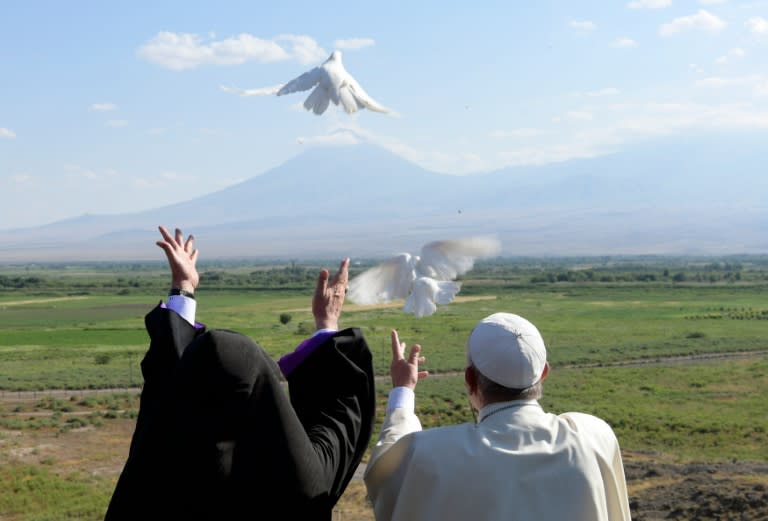 Pope Francis and Catholicos of All Armenians Karekin II release white doves in the direction of Mount Ararat during a visit to the Khor Virap monastery