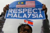 <p>A member of the youth wing of the National Front, Malaysia’s ruling coalition, holds a placard during a protest at the North Korea embassy, following the murder of Kim Jong Nam, in Kuala Lumpur, Malaysia, Feb. 23, 2017. (Photo: Athit Perawongmetha/Reuters) </p>