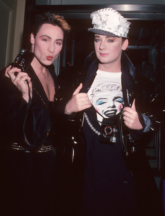<p>Brit pop singers Marilyn (a.k.a. Peter Robinson) and Boy George, who was the lead singer of Culture Club, attended the 1985 premiere. (Photo: WireImage)</p>