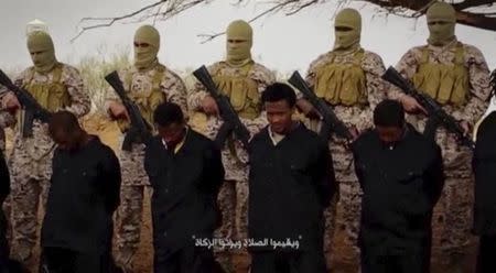 Islamic State militants stand behind what are said to be Ethiopian Christians in Wilayat Fazzan, in this still image from an undated video made available on a social media website on April 19, 2015. The video purportedly made by Islamic State and posted on social media sites on Sunday appeared to show militants shooting and beheading about 30 Ethiopian Christians in Libya. Reuters was not able to verify the authenticity of the video but the killings resemble past violence carried out by Islamic State, an ultra-hardline group which has expanded its reach from strongholds in Iraq and Syria to conflict-ridden Libya. Libyan officials were not immediately available for comment. Ethiopia said it had not been able to verify whether the people shown in the video were its citizens. REUTERS/Social Media Website via Reuters TVâ€¨â€¨ATTENTION EDITORS - THIS PICTURE WAS PROVIDED BY A THIRD PARTY VIDEO. REUTERS IS UNABLE TO INDEPENDENTLY VERIFY THE AUTHENTICITY, CONTENT, LOCATION OR DATE OF THIS IMAGE. THIS PICTURE IS DISTRIBUTED EXACTLY AS RECEIVED BY REUTERS, AS A SERVICE TO CLIENTS.â€¨