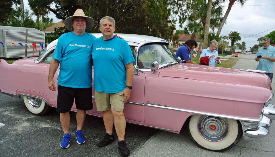 Norman Dize (left) and Pastor John Shultz stood beside a pink Cadillac that was in the classic car show to benefit One Church Jacksonville Beach. The fundraiser also included a "car-be-que."