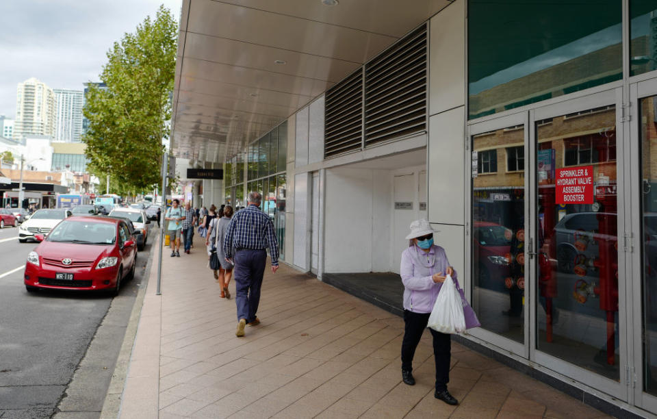 People out in the suburb of Chatswood during the middle of the morning.